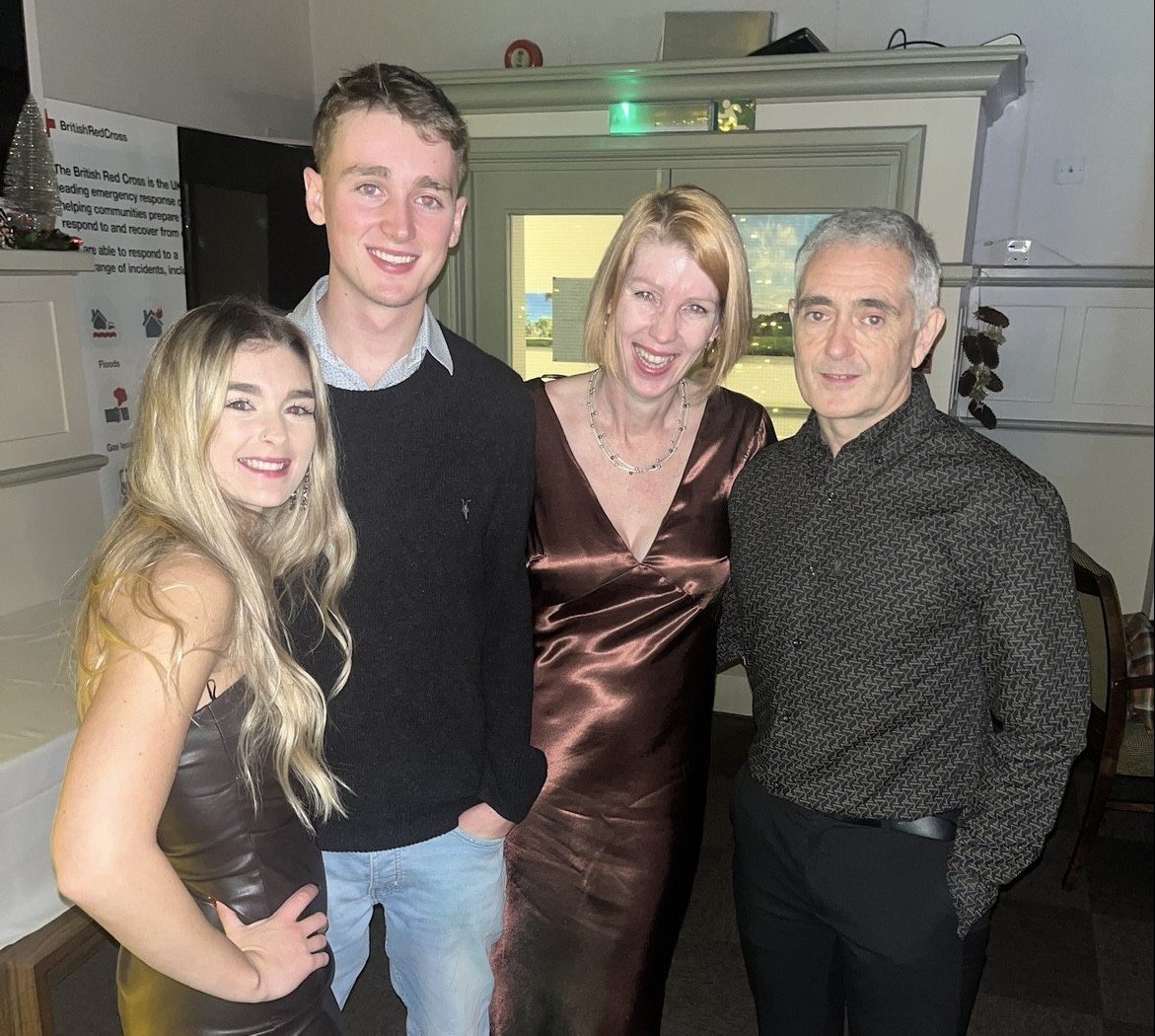 Daughter Cara, son Cian, wife Toni and husband Paul posing, dressed up, at home
